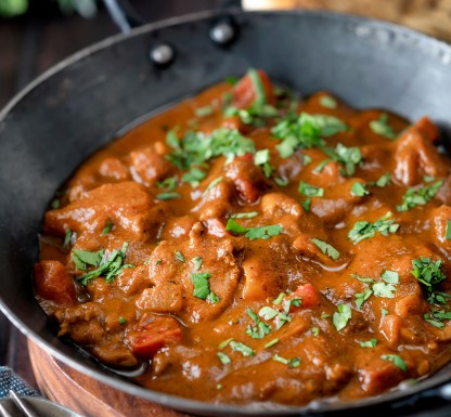 Cooked in a creamy sauce with a touch of spices and herbs, then